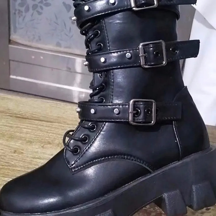 Black women's mid-calf knight boots with a metal buckle and side zip on a white background.
