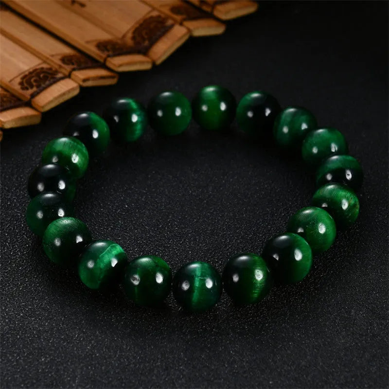 Natural green tiger eye stone bracelet with geometric polished beads in various sizes