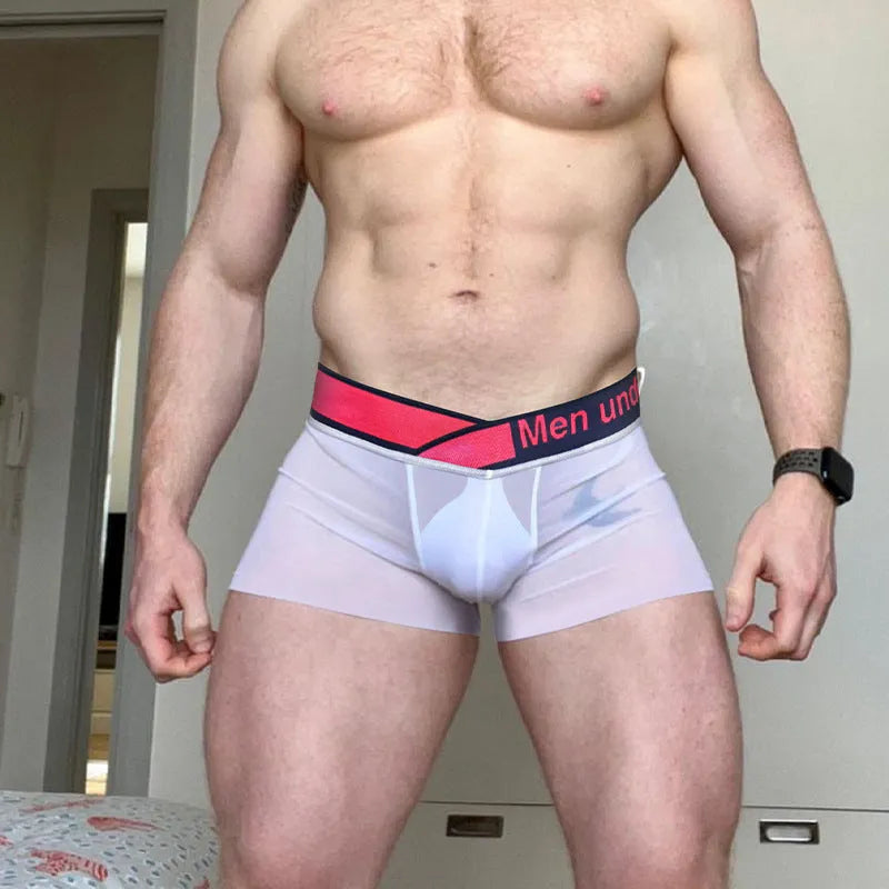 Men's black low waist seamless underwear with a red gradient laser print design on the front