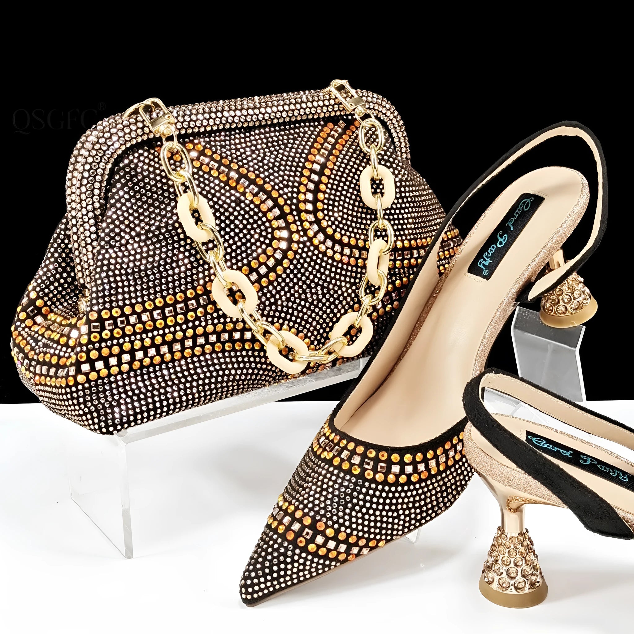 Women's pink pointed toe high heel shoes with rhinestones and a matching small clutch bag.
