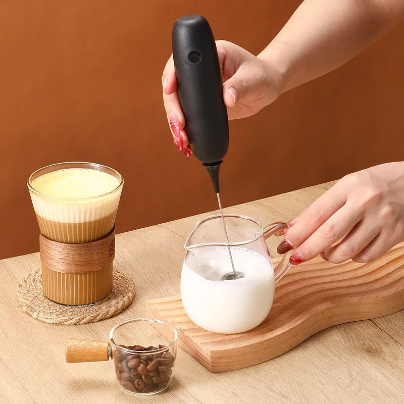 Black and white handheld electric milk frother blender for coffee milk frothing