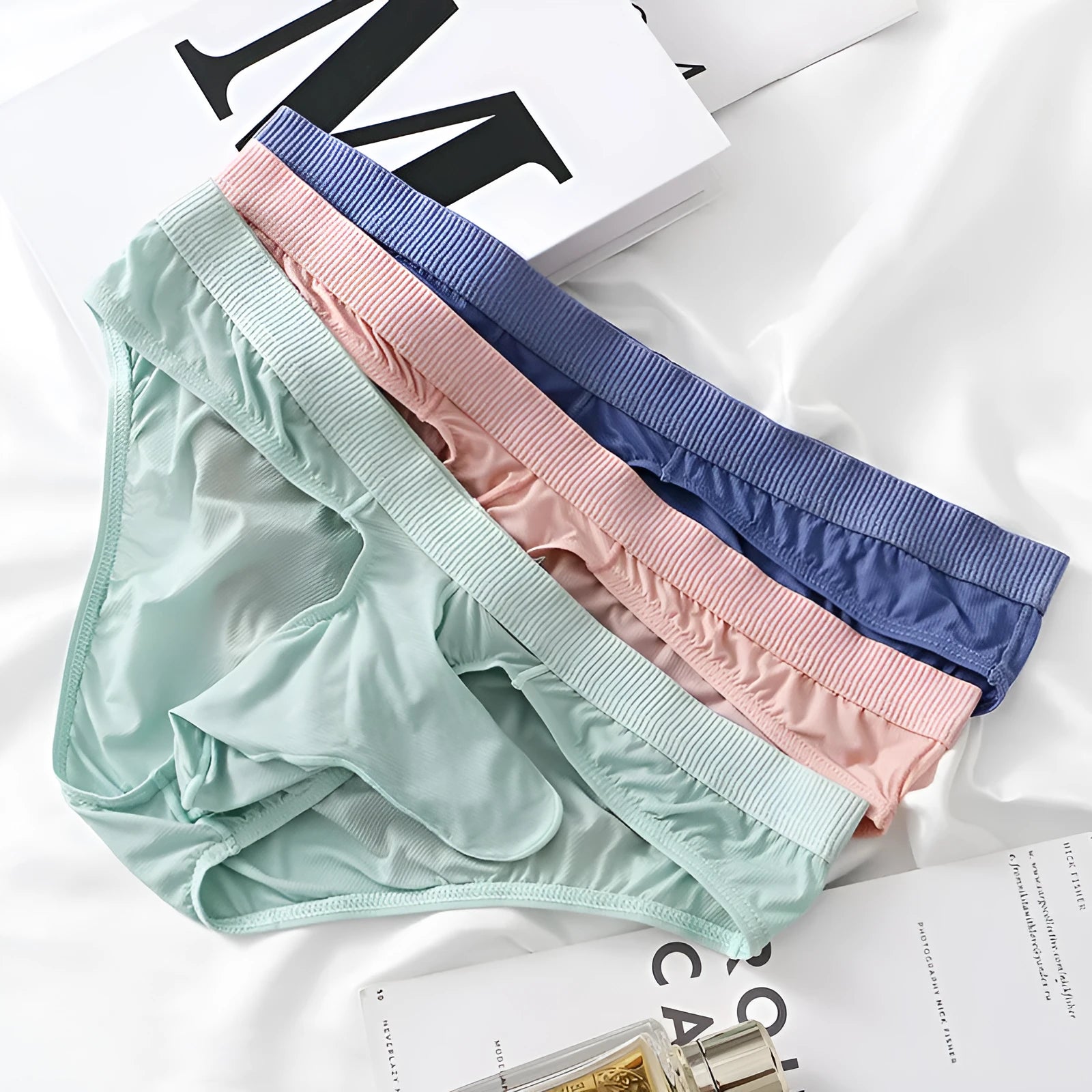 Men's Ice Silk low waist briefs underwear shown in multiple colours with size chart