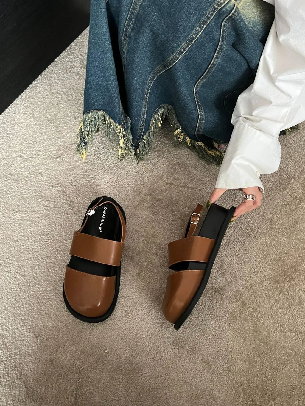 Retro style closed toe sandals with a single ankle buckle strap in apricot colour.