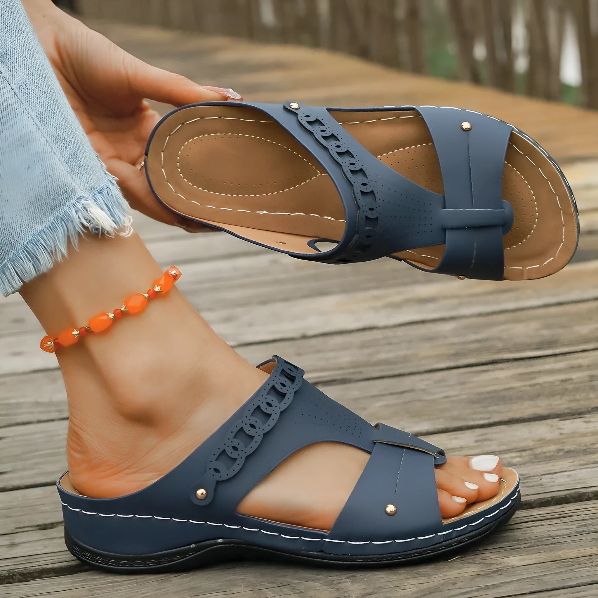Roman style slippers showing heel slope design and fish mouth toe in beige colour on rubber sole
