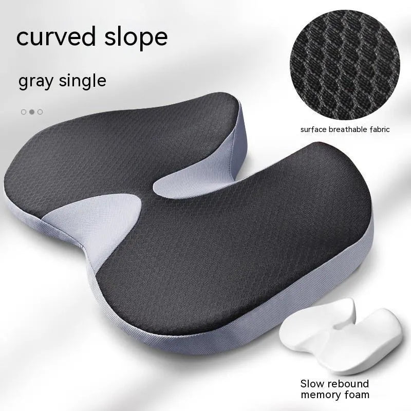 Curved memory foam seat cushion in beige for tailbone and back support