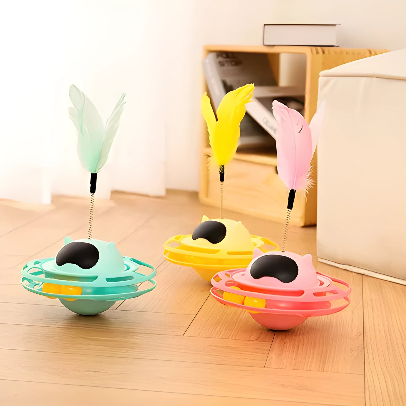 Pink stick-shaped cat toy turntable tumbler with self-hi feature on flat surface