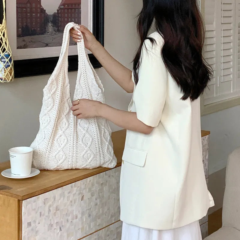 Retro hollow knitted polyester tote bag in a solid colour with double shoulder straps.