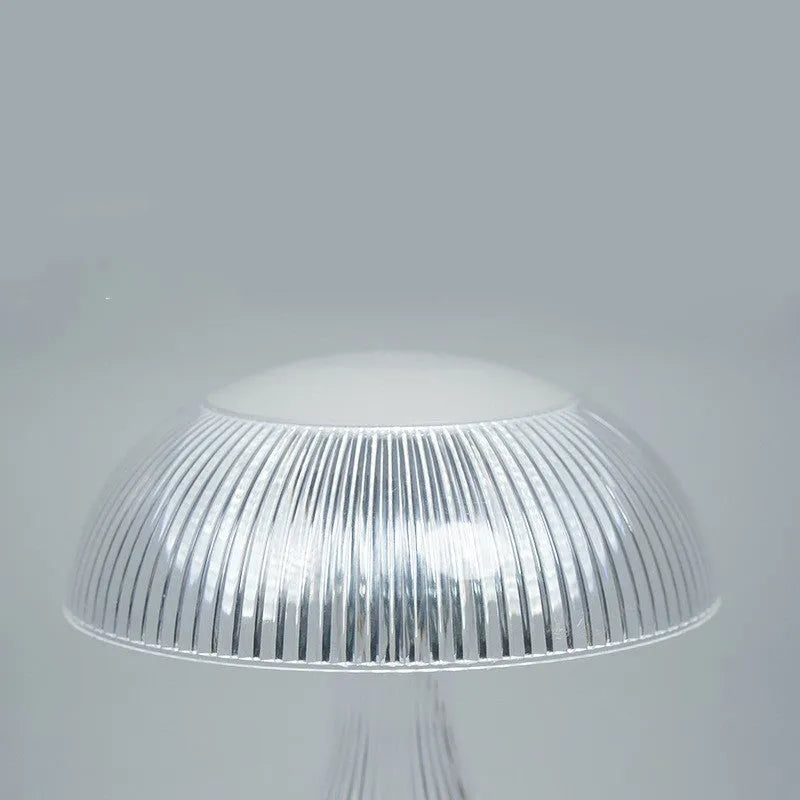 Rechargeable touch night lamp with acrylic body on a plastic base, showing three LED light colours.