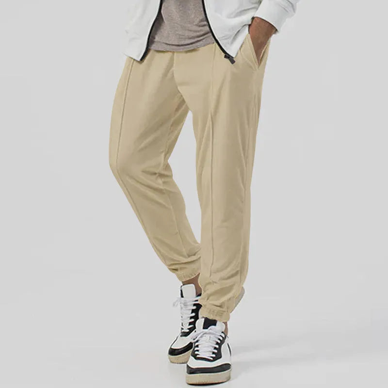 Men's gray elastic track sweatpants with straight-leg tapered design and mid waist