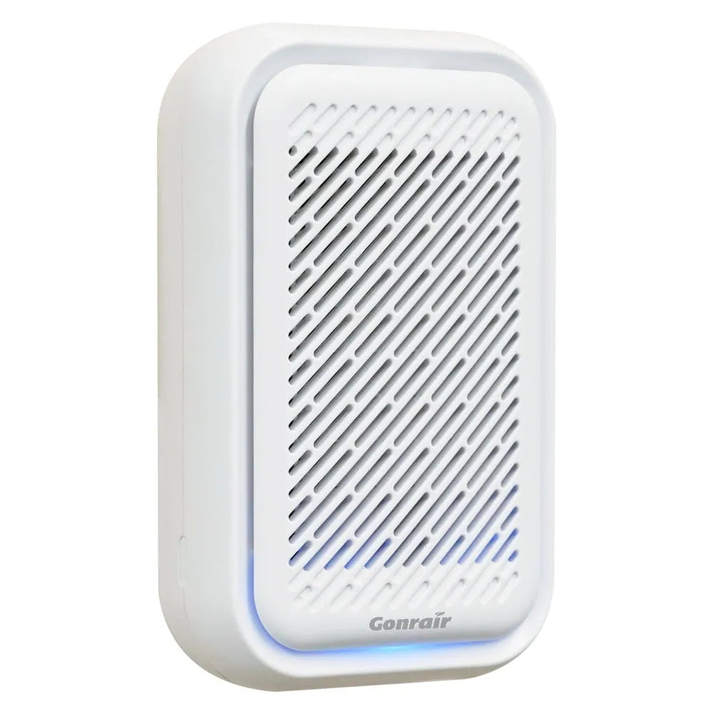 White wall-mounted plug-in air purifier with filter screen for small rooms.