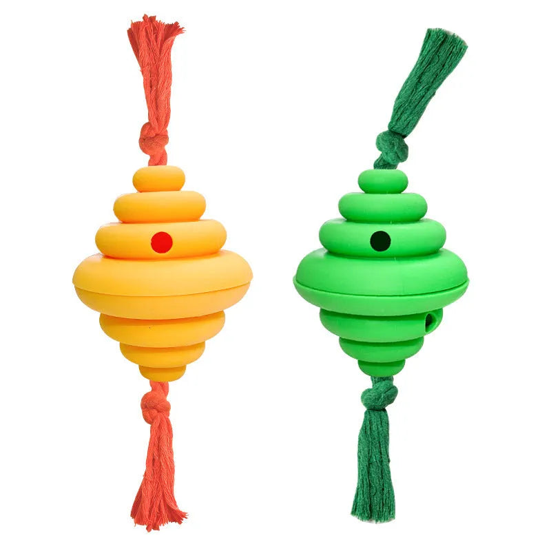 Large green and yellow silicone dog toy with a knotted rope and hollow ball for food dispensing.
