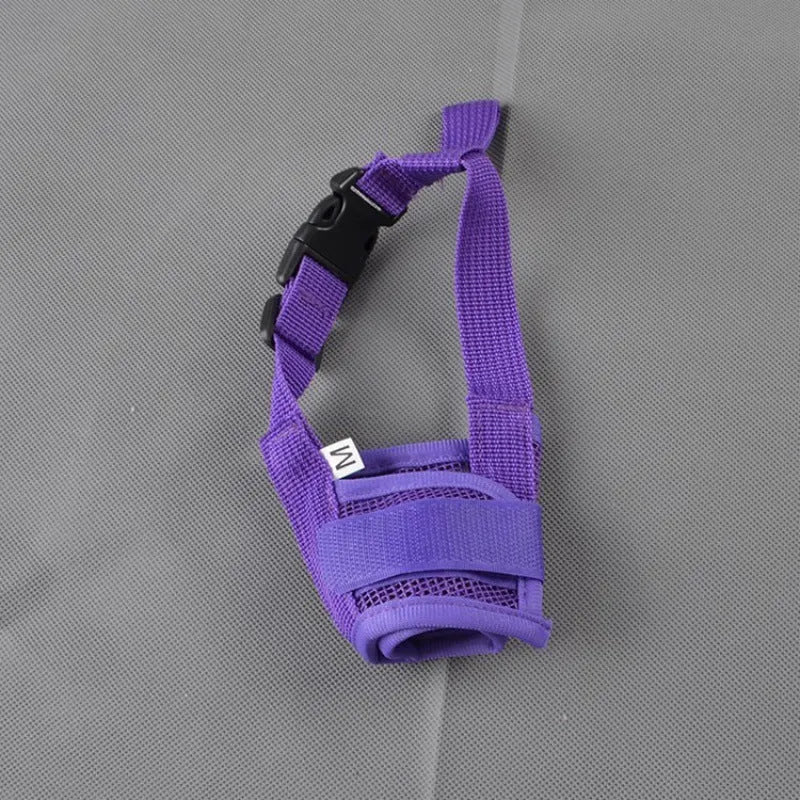 Adjustable plastic basket-style dog muzzle in red, shown on a dog's snout with quick-release buckle.