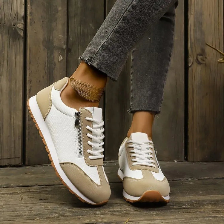 Women's flat-heeled shoes in artificial PU, available in Champagne, Gray, and White colours with a rubber sole.
