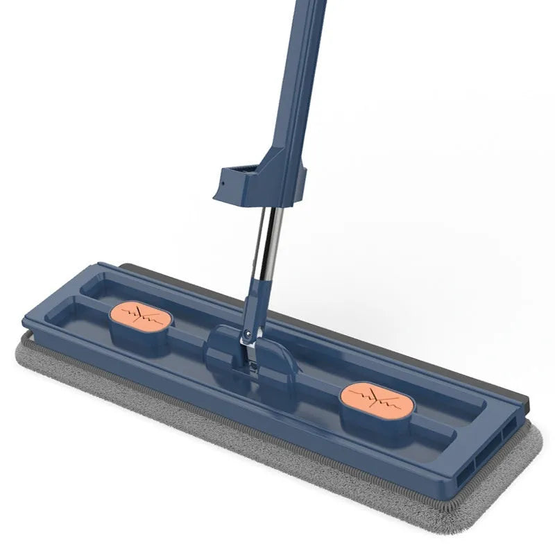 Large flat mop with stainless steel handle and blue rotating mop head on hard floor
