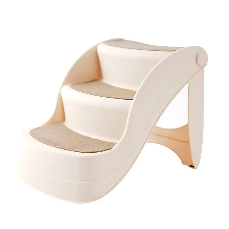Foldable plastic pet step ladder in beige colour with non-slip mat, placed next to a sofa.