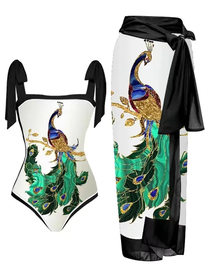 Women's floral print two-piece swimsuit with a blue chiffon skirt laid flat.