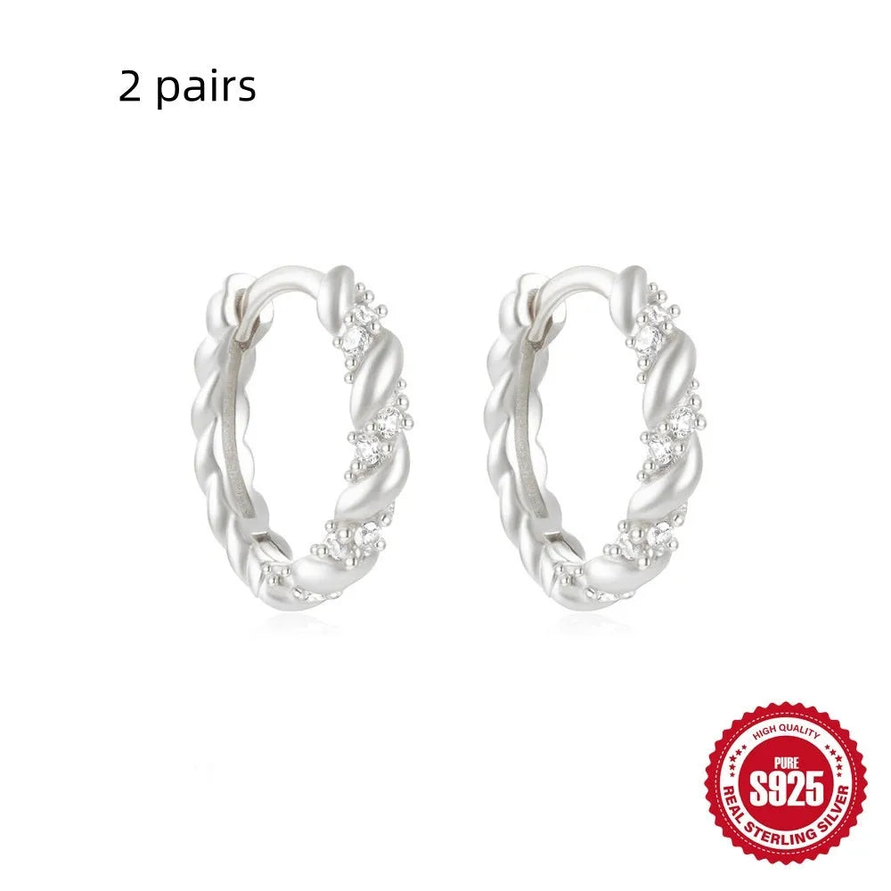 Sterling silver geometric stud earrings with small round diamond accents in gold or silver electroplated finish