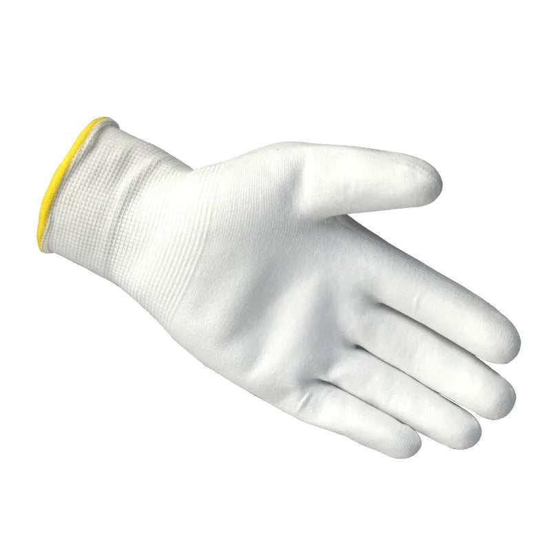 White PU coated labour gloves showing textured palm and flexible design, laid flat.