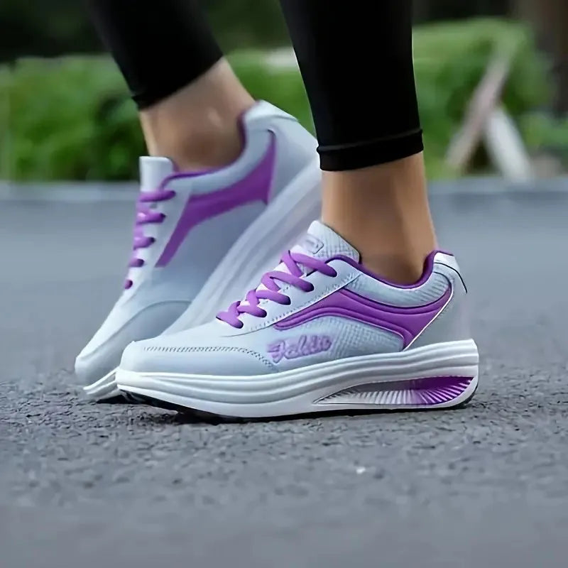 Women's slip-on casual shoe in a mid-heel style, shown in one of the available colours.
