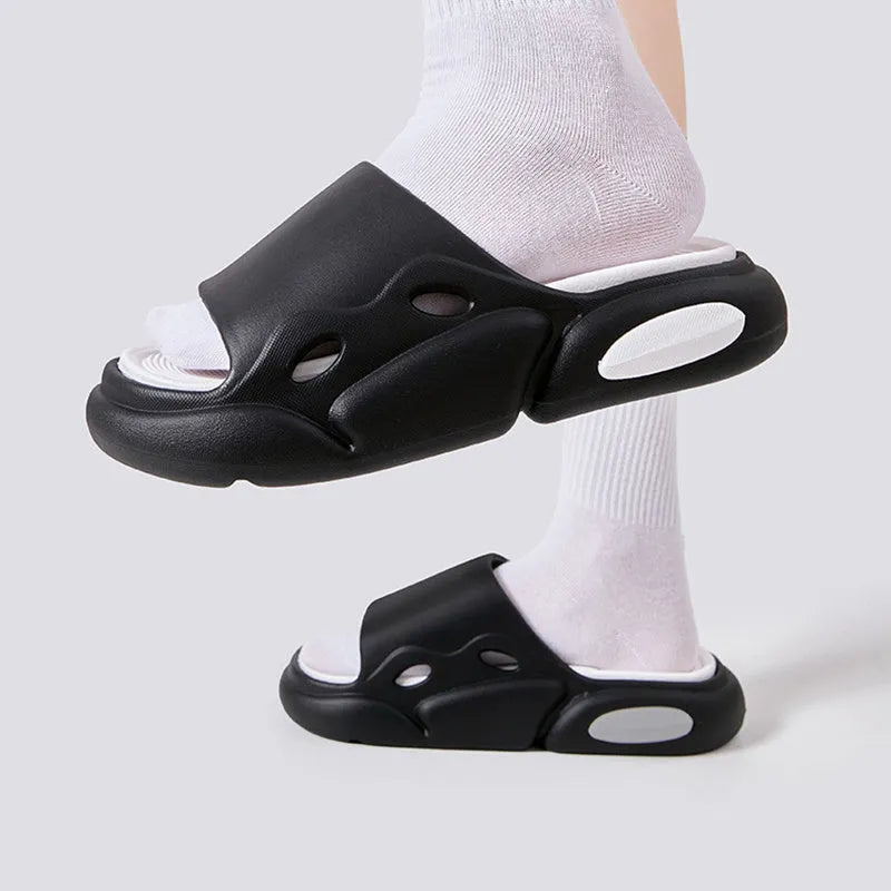 Two-colour EVA couples slippers with thick sole and leather lining in pink purple, shown from the side.