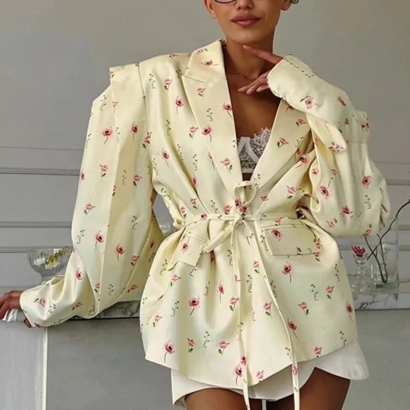Women's suit jacket with lace-up waist detail in polyester fabric, shown in apricot colour