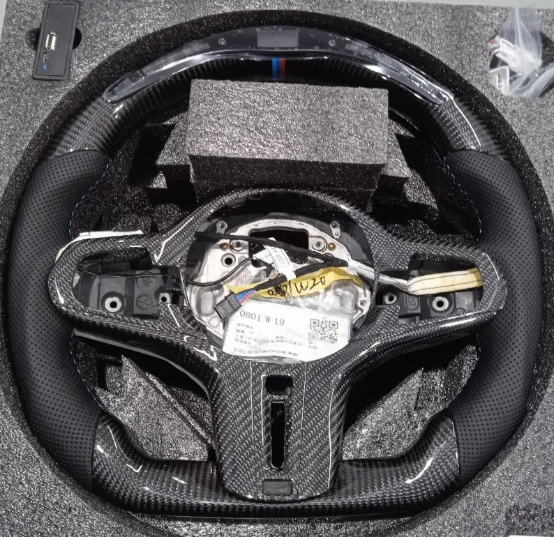 Black carbon fibre BMW sports steering wheel with LED display for X3 X5 models.