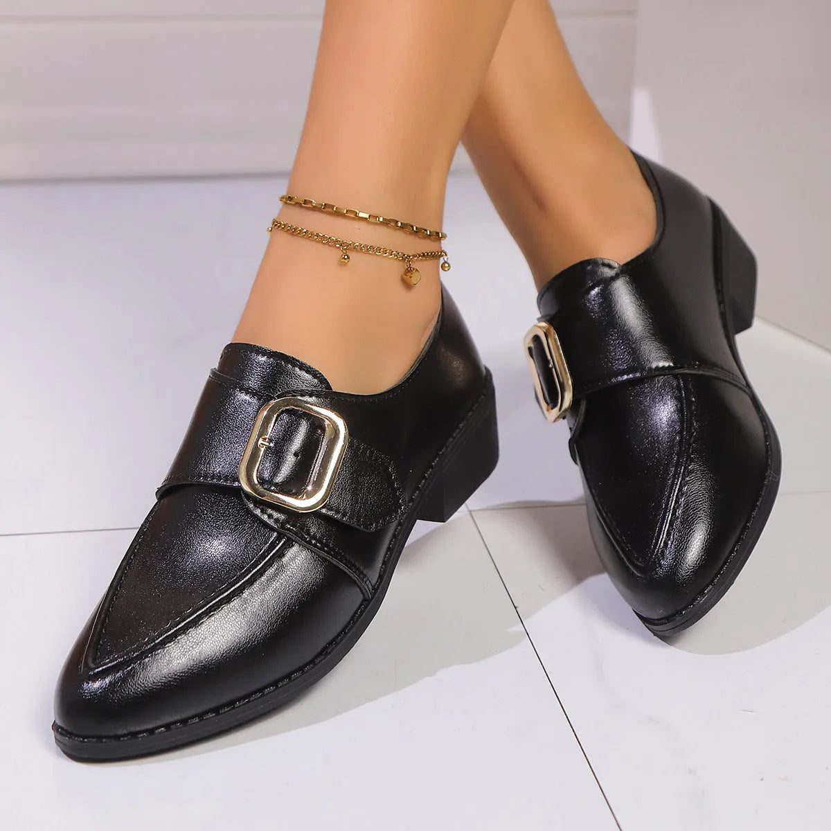 Women's British-style leather shoes with decorative bow detailing on pointed toe