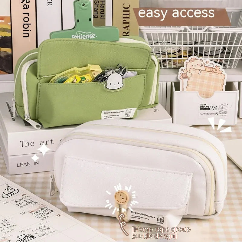 Korean style canvas pencil case in green holding multiple pens