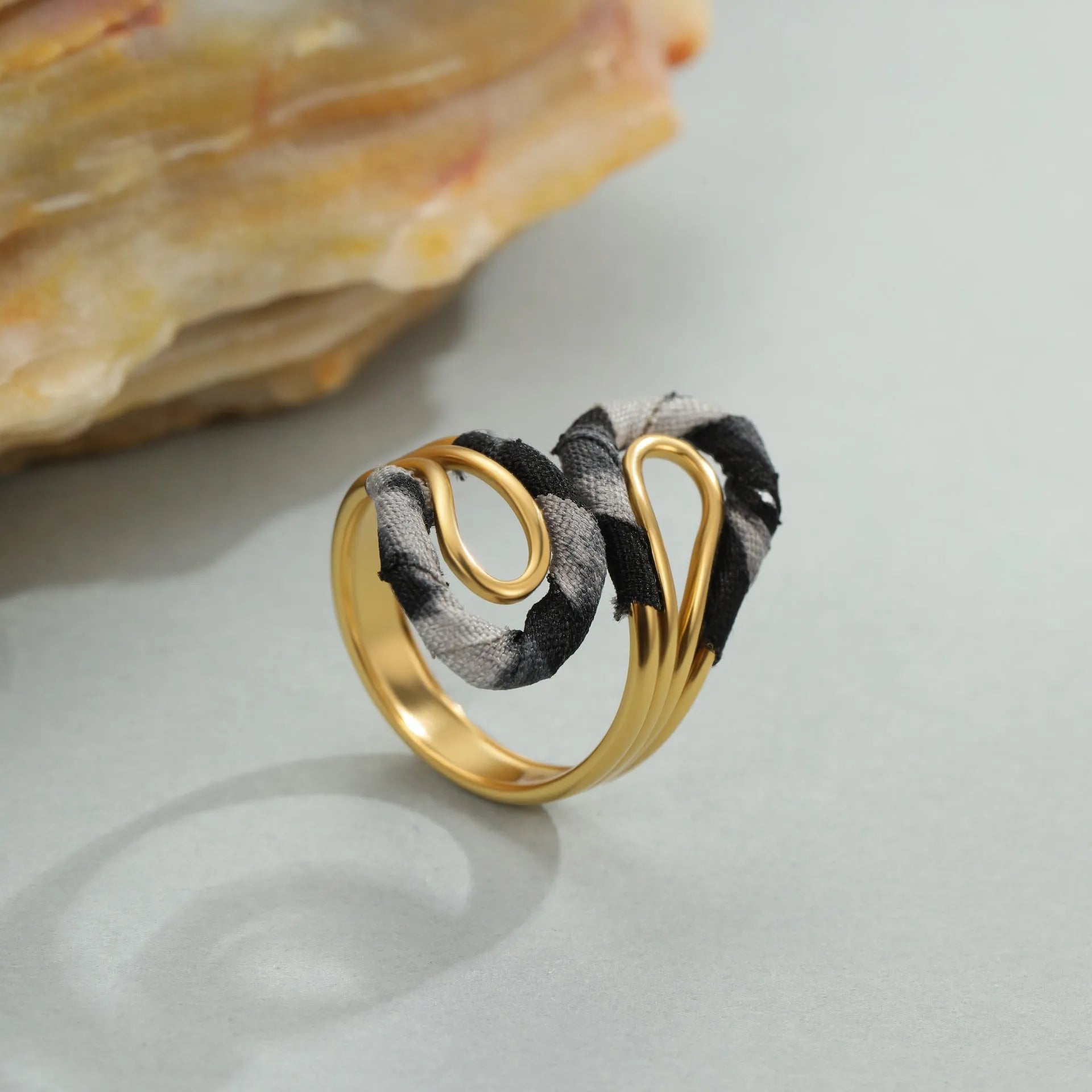 Geometric stainless steel open mouth ring with leopard print patterns in heart and star shapes