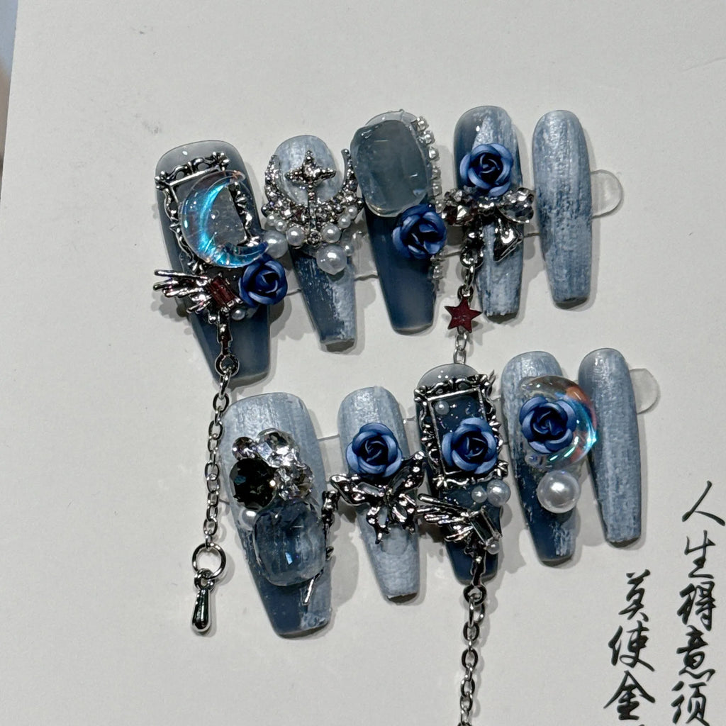 Heavy industry night blue manicure set with ornate rose design and plastic storage case.