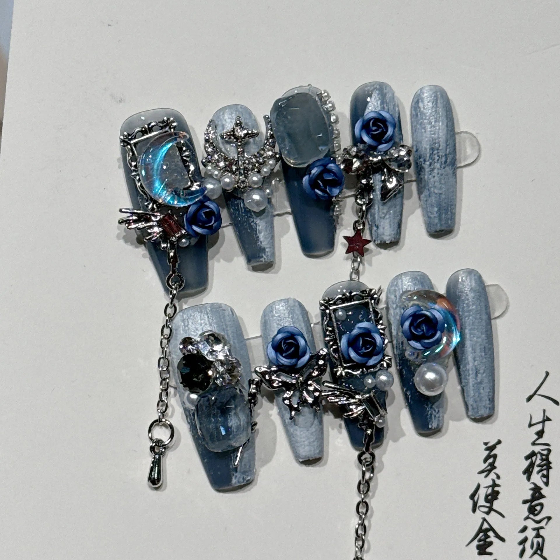 Heavy industry night blue manicure set with ornate rose design and plastic storage case.