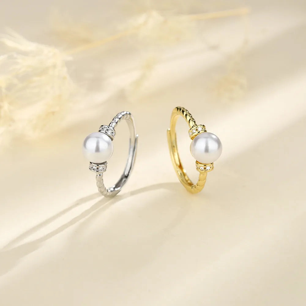 Adjustable copper pearl ring with geometric antique twist design in gold and silver finish options