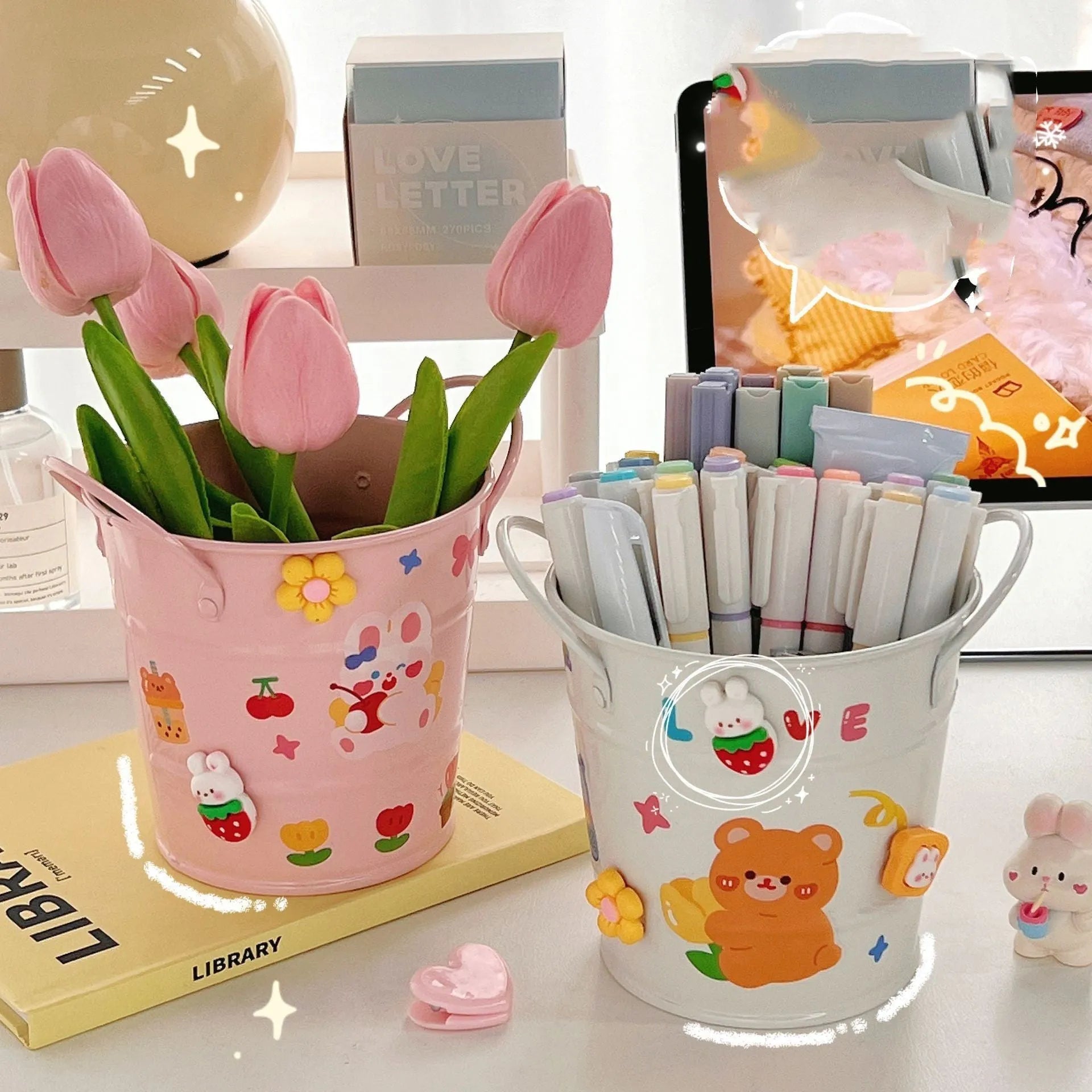 Round metal desktop pen holder in a choice of colours, some with decorative sticker patches.