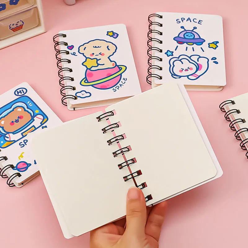 Astronaut-themed flipper notebook measuring 10.5cm by 8cm with space design cover options