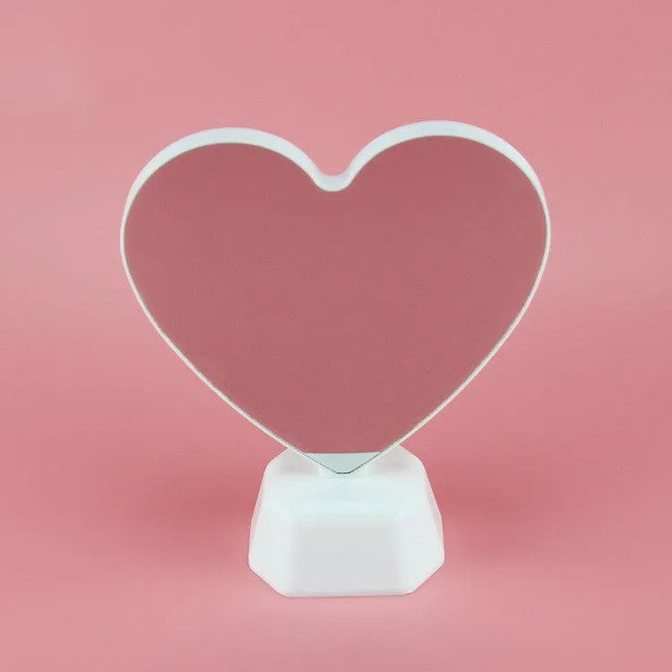 Rose red double-sided LED love tunnel decorative light on a table.