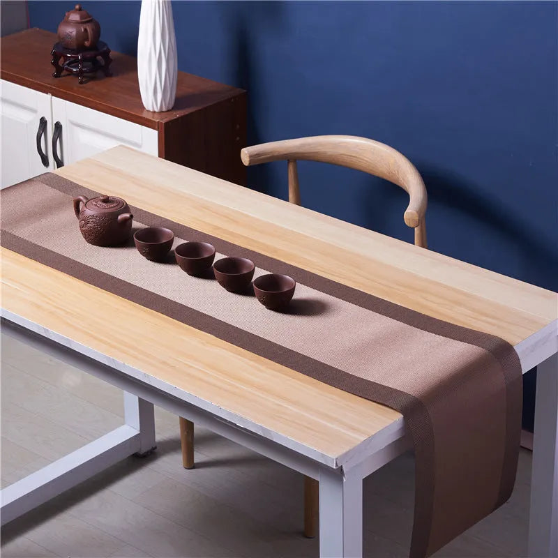 Non-slip PVC place mat in modern simple style, showing gradient bamboo black colour option on a kitchen counter.