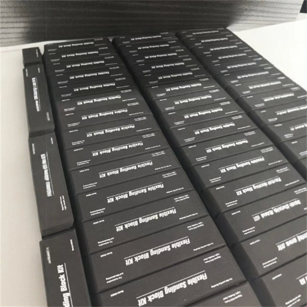 Set of seven black frosted EVA building blocks with visible metal connector fittings.