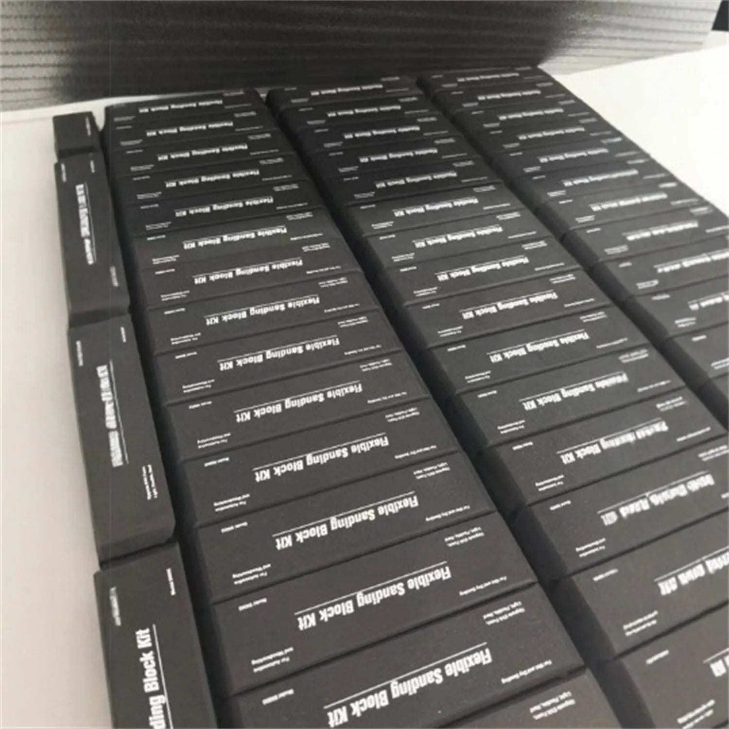 Set of seven black frosted EVA building blocks with visible metal connector fittings.