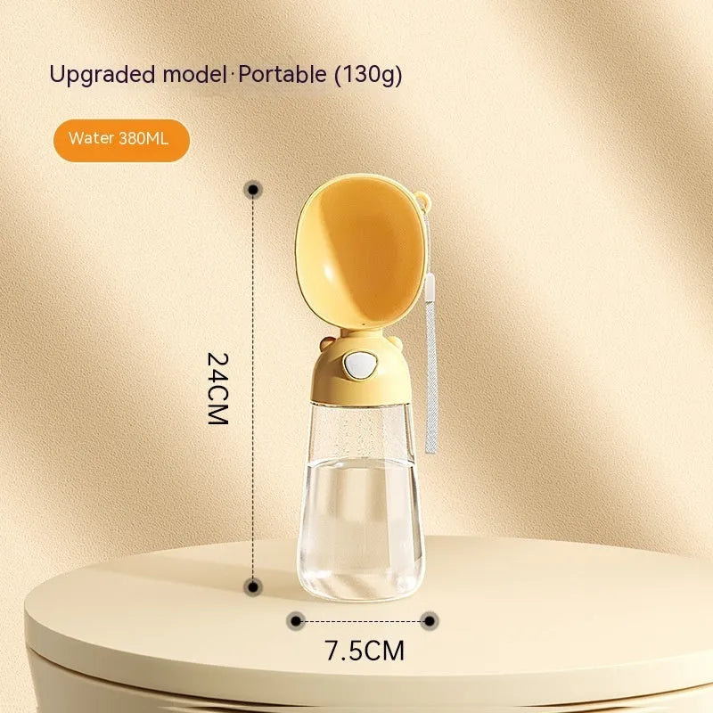 Portable plastic dog water bottle with attached feeding bowl in yellow colour