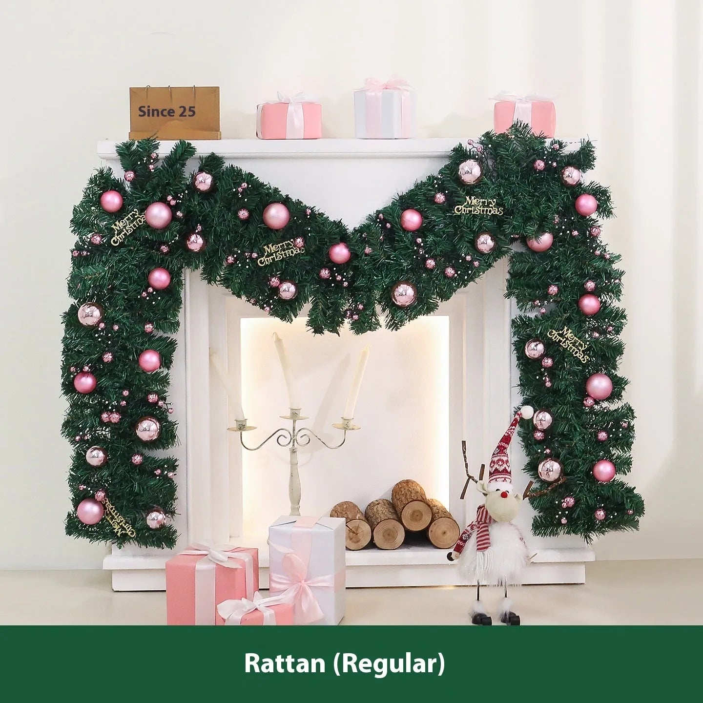 Pink Christmas rattan garland with small fruit details and LED lights draped across doorway