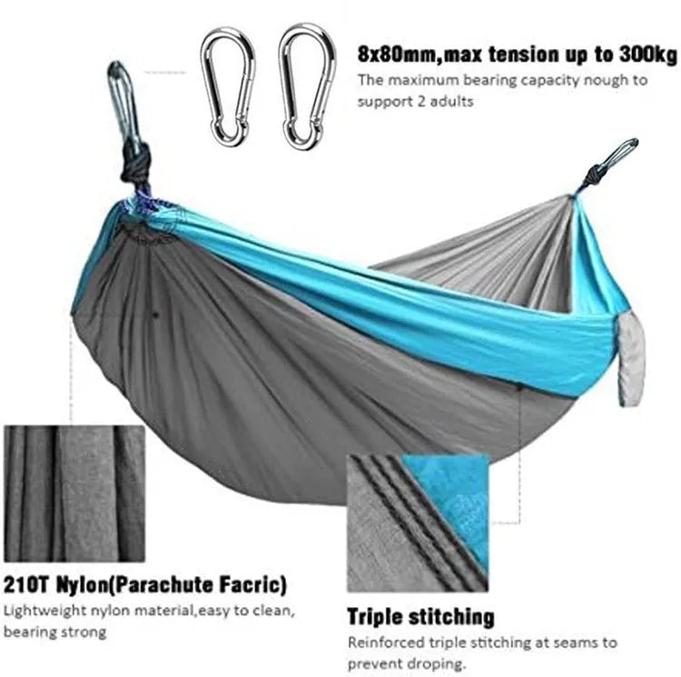 Blue parachute cloth nylon camping hammock shown hung between trees with 270cm length