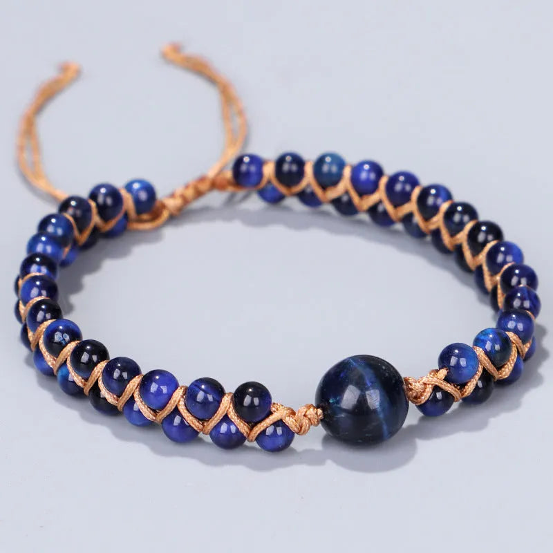 Handmade woven pull bracelet with tigereye and amethyst beads in geometric pattern