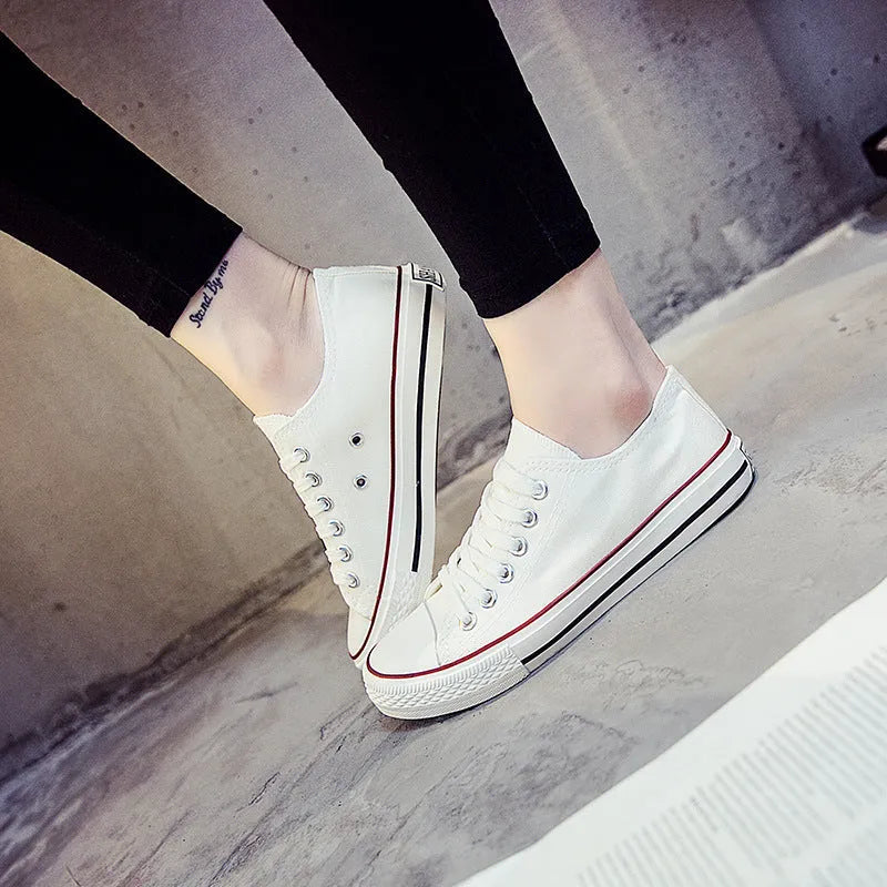 Women's solid colour casual canvas shoes in lace-up style on a white background.