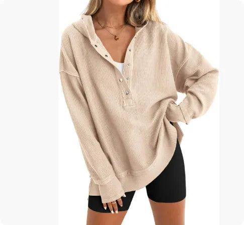Women's loose peacock green raglan sleeve pullover sweater on a hanger.