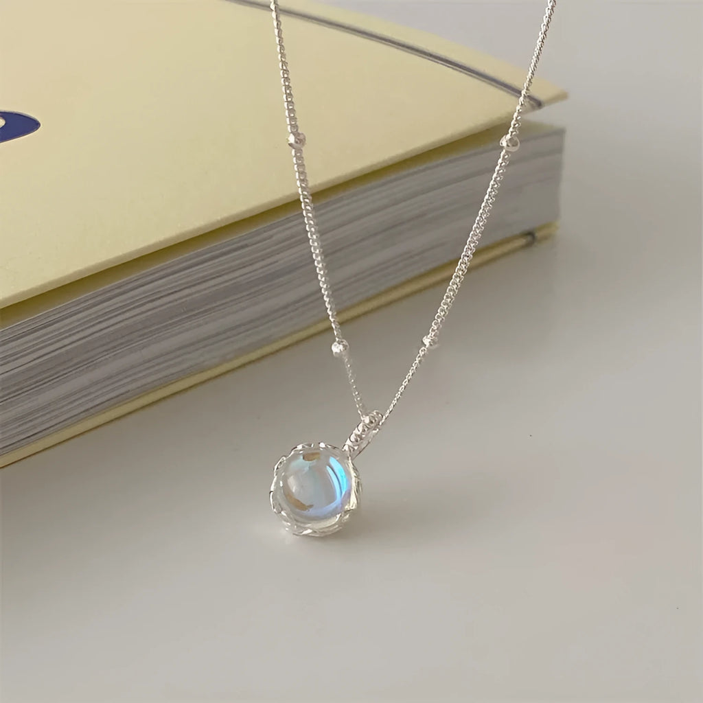 925 silver geometric round pendant necklace with ornamental stone on an adjustable curb chain.