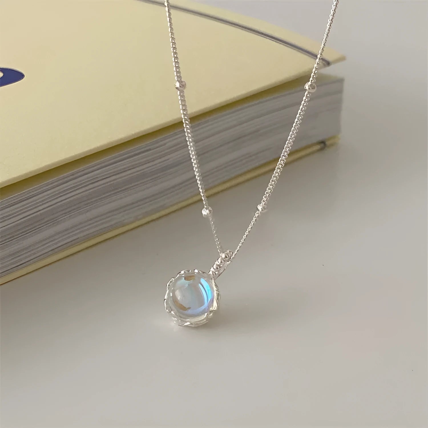 925 silver geometric round pendant necklace with ornamental stone on an adjustable curb chain.