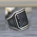 Black alloy ring with copper inlay and zircon stones showing gothic design details