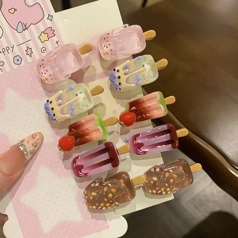Resin hair barrette featuring a cartoon ice cream design in pink, red, coffee, purple, and beige colour options.