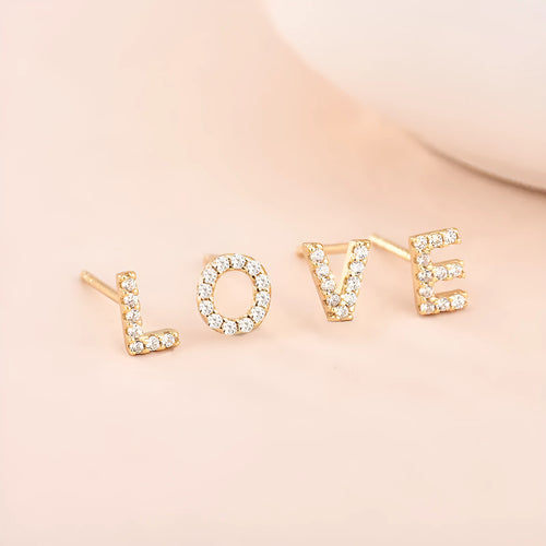 Gold plated alphabet letter earrings with zircon details showing English character design