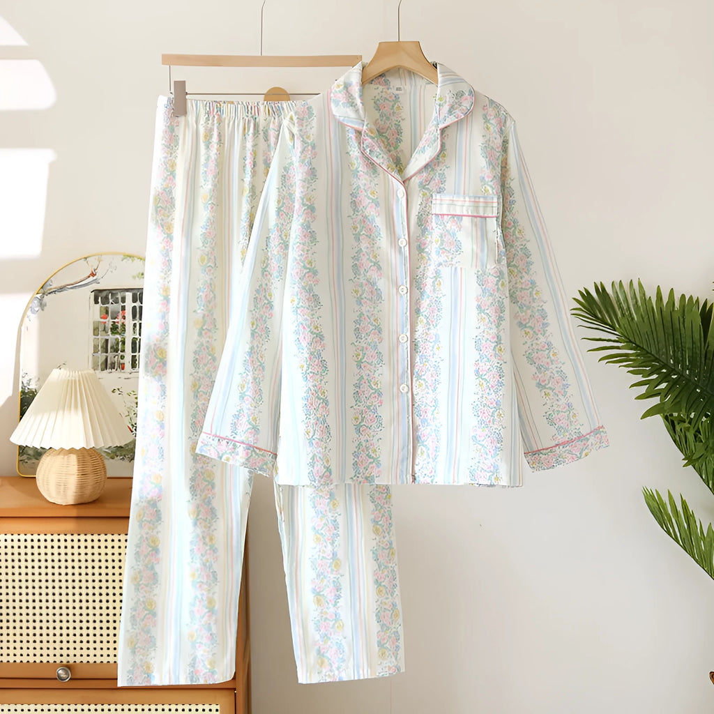 Ladies' red and white striped cotton gauze long-sleeved top and trousers loungewear set laid flat.